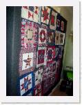 designwall * May 30, 2006 -- Here is my new design wall. We set up some felt in the hallway. However, for some reason, the blocks just don't stay on for very long before they start falling off so I still have to pin them up. 
Displayed here is the Hero Stars (title not finished) quilt I am working on to donate to Sean Hannity (hoefully) so he can raffle it off to raise money for the Children's Scholarships for the Slain Soldiers.  * 375 x 500 * (70KB)